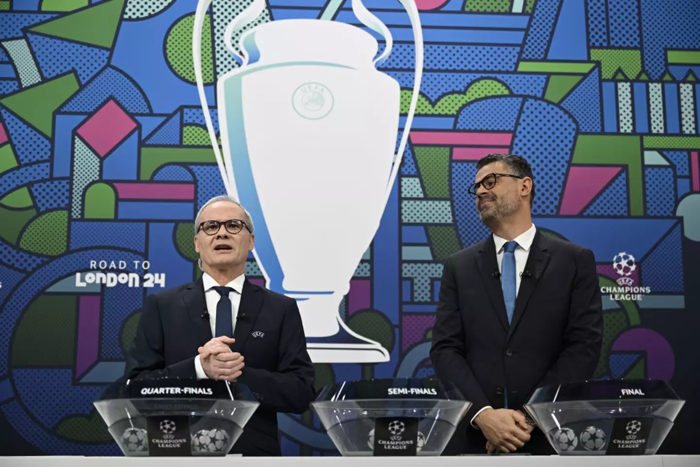 Giorgio Marchetti and Pedro Pinto performing a 2023/2024 Champions League draw -